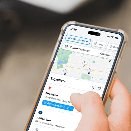 A person holding a smartphone with a navigation app open, showing a map and various options for transportation. A person holding a smartphone with a navigation app open, showing a map and various options for transportation.