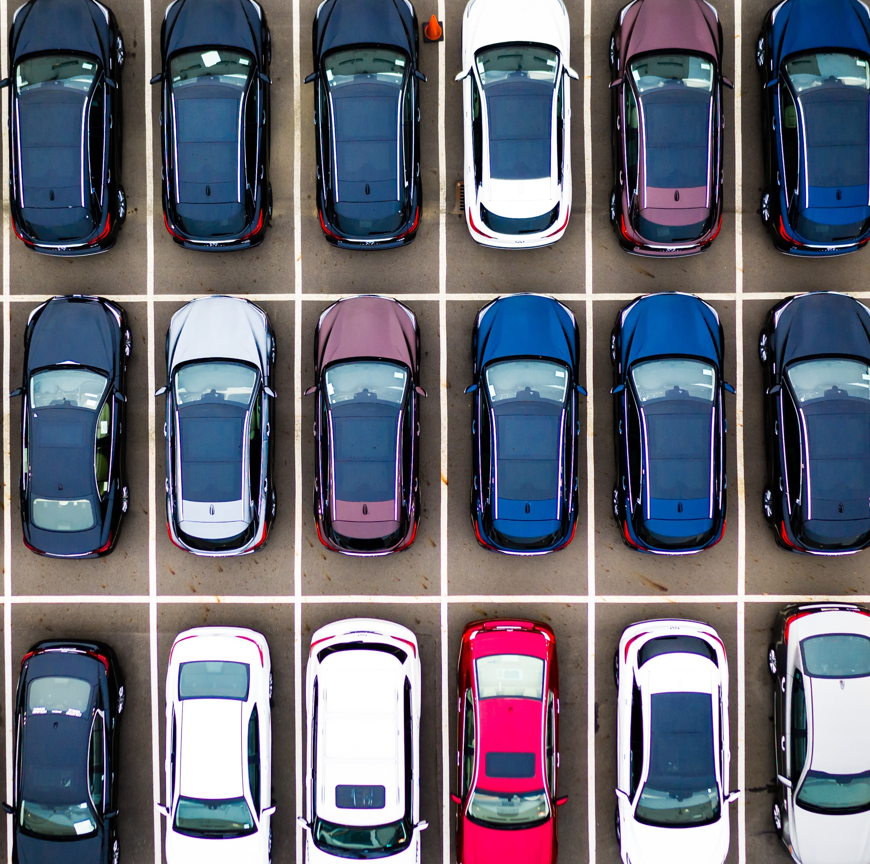 Fleet vehicle selection concept showing rows of parked cars in a lot, highlighting variety and organization for fleet planning decisions Fleet vehicle selection concept showing rows of parked cars in a lot, highlighting variety and organization for fleet planning decisions
