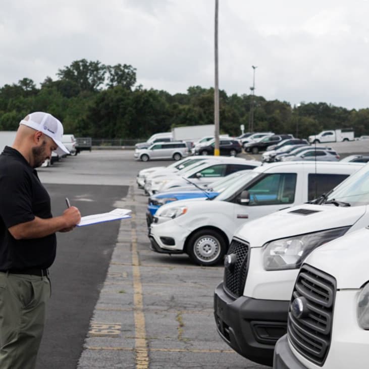 Element's vehicle auction expert analyzing fleet vehicles up for resale. Element's vehicle auction expert analyzing fleet vehicles up for resale.