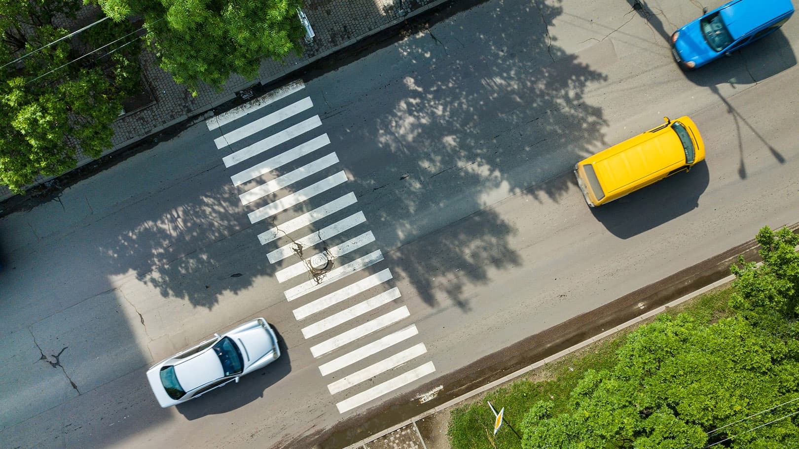 top-down-aerial-view-busy-street-with-cars-and-crosswalk top-down-aerial-view-busy-street-with-cars-and-crosswalk